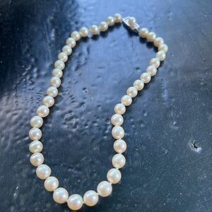 Genuine pearl necklace.